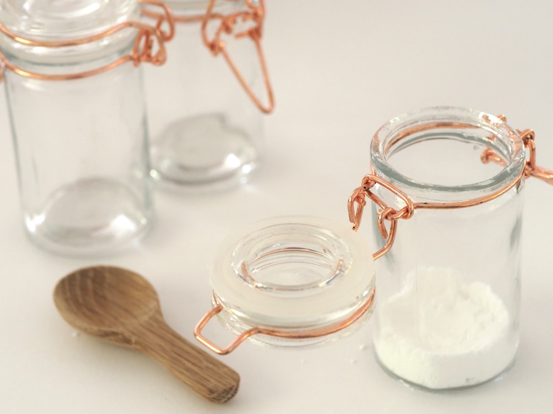 open-glass-jar-near-brown-wooden-spatula-wfu0ab9mkjc